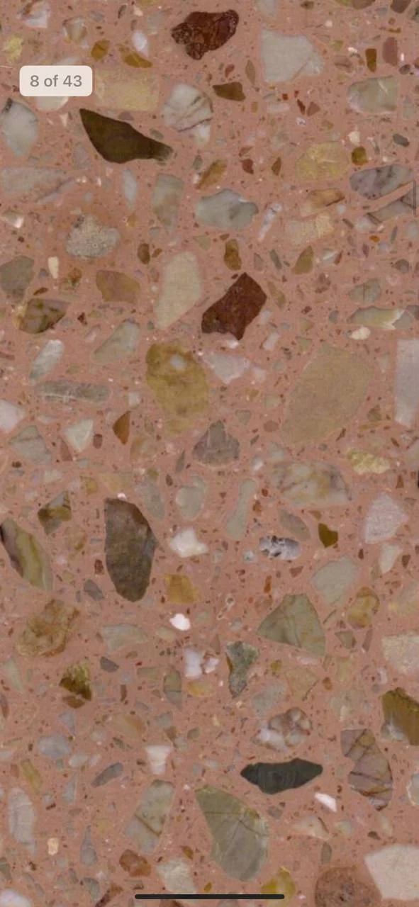 Slab reference with pink tones and large pale and brown fragments.
