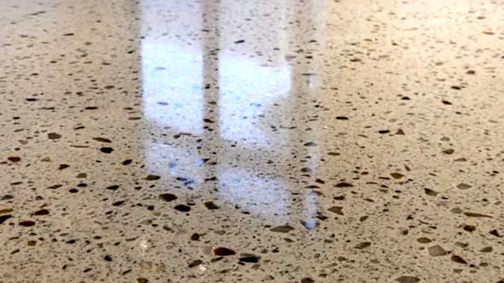 Polished terrazzo aggregate and reflected light on the floor at Saadiyat Island Villa.