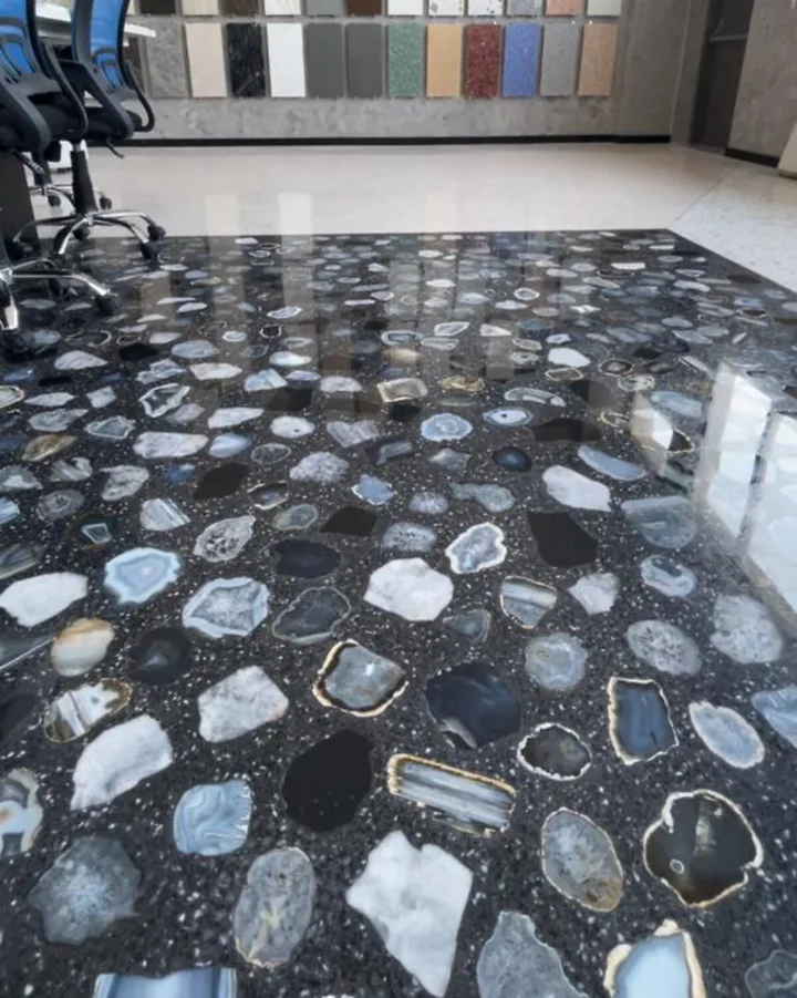 Large decorative aggregate pieces in the polished floor at Office Agate.